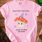 Pink t-shirt with "plans? yeah, i have some... mostly canceling and snacks" and a mushroom graphic.