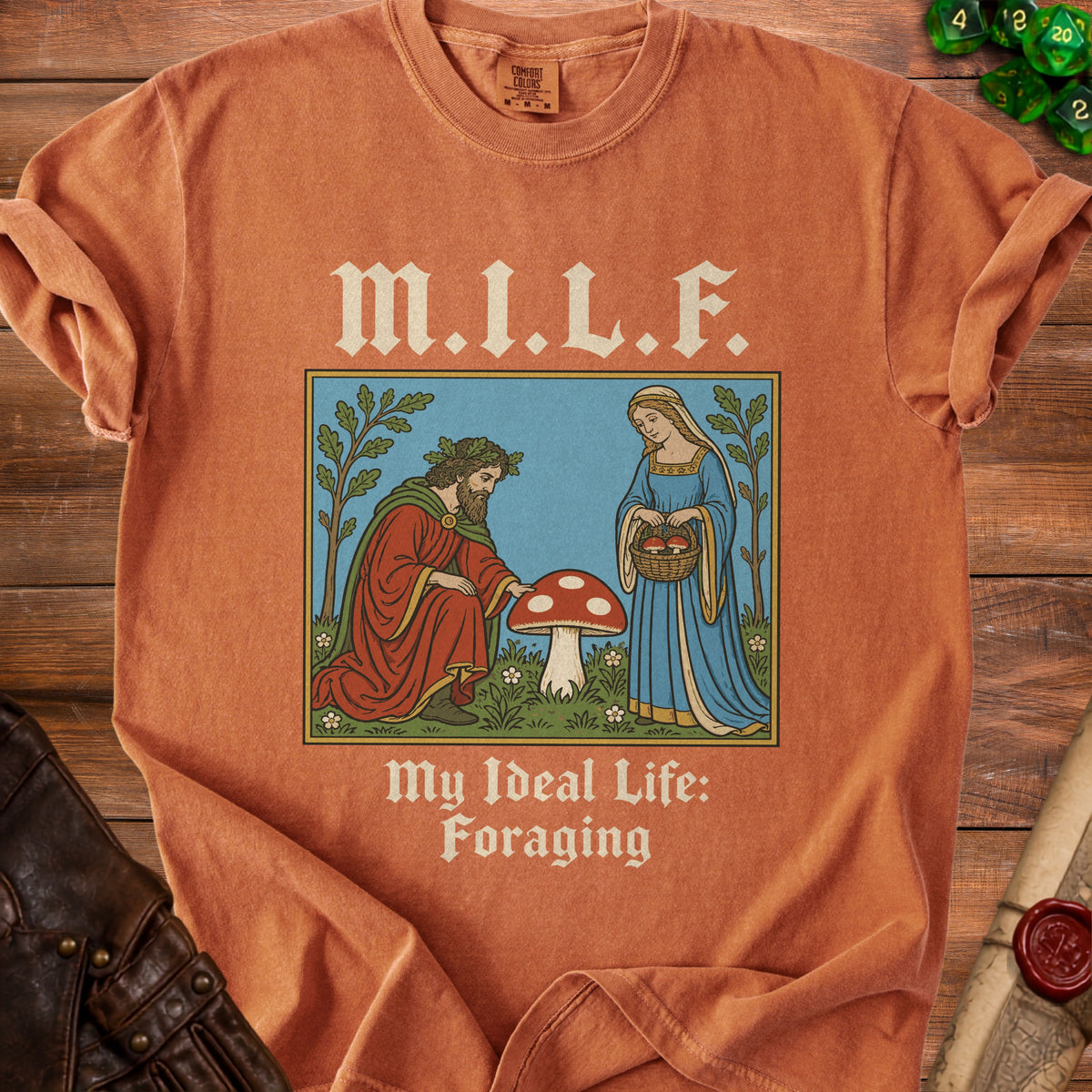 Orange t-shirt with "M.I.L.F. My Ideal Life: Foraging" and an illustration.