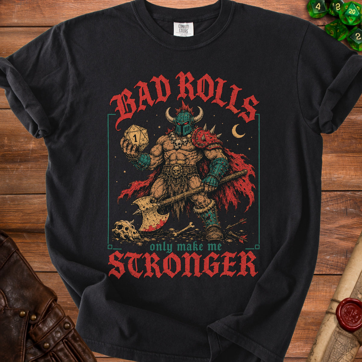 Black t-shirt with "Bad Rolls Only Make Me Stronger" text and barbarian graphic.