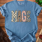 Blue t-shirt with "MAGE" text in patterned, distressed letters.