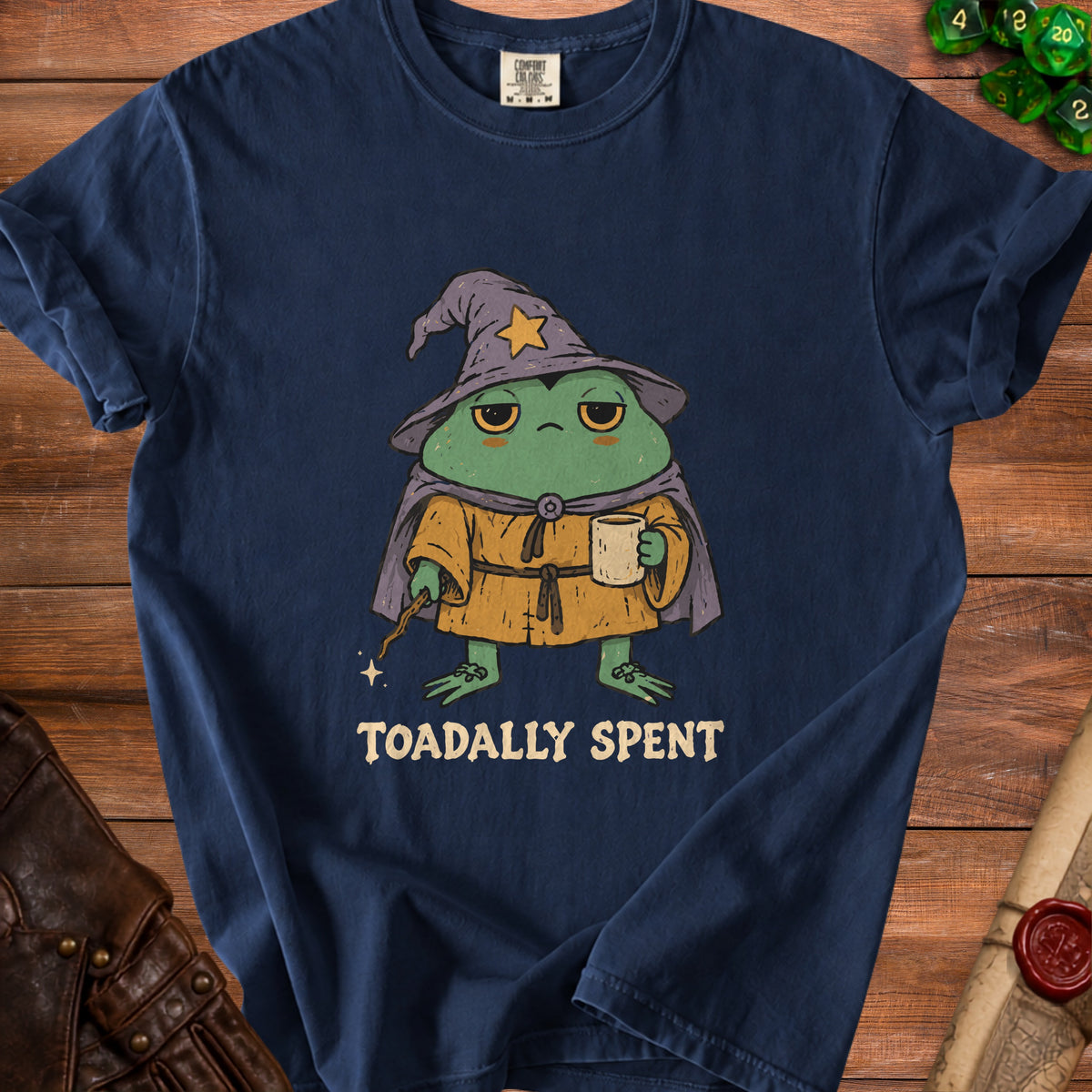 T-shirt with cartoon wizard frog holding coffee and wand, text "TOADALLY SPENT"