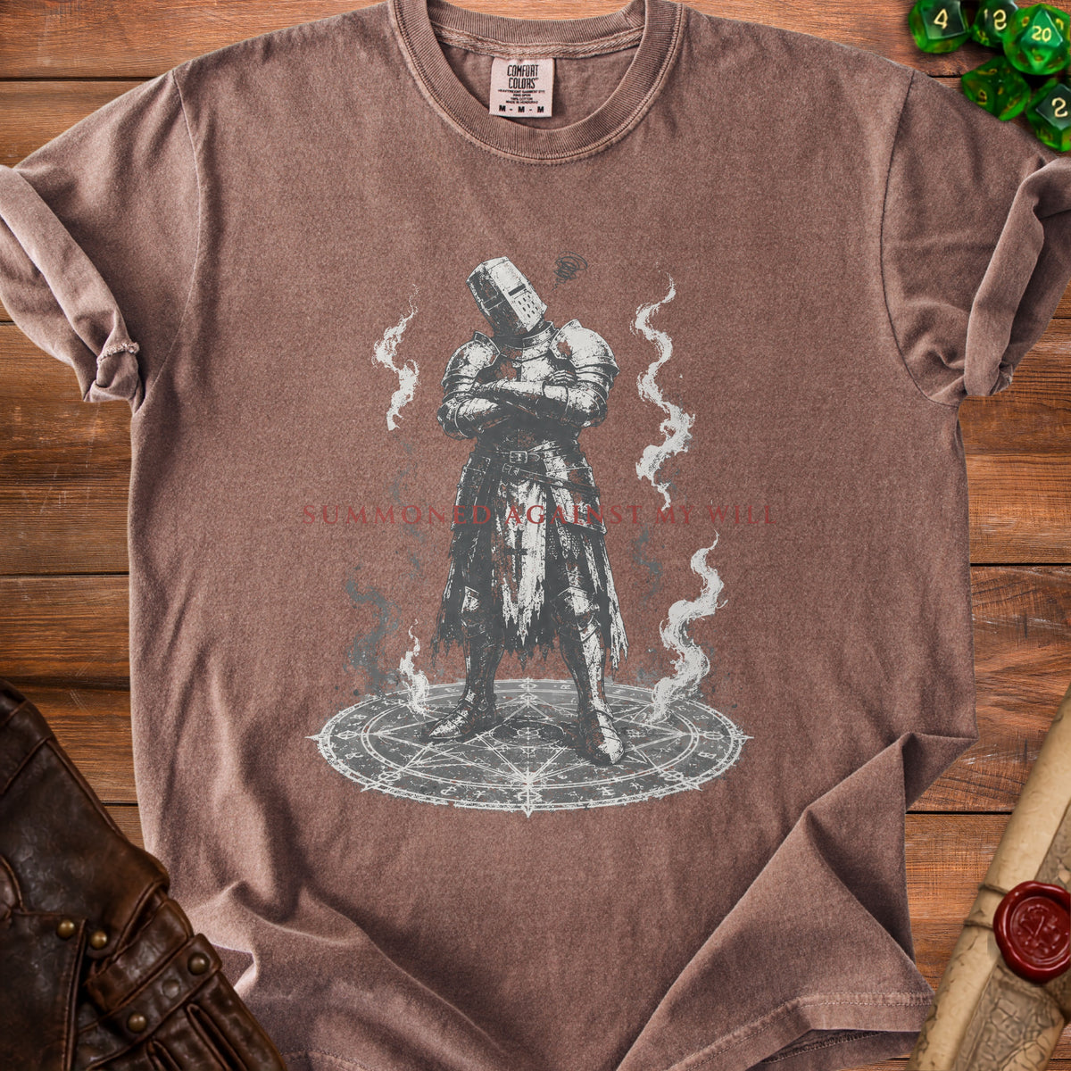 Brown t-shirt with knight graphic and "SUMMONED AGAINST MY WILL" text.