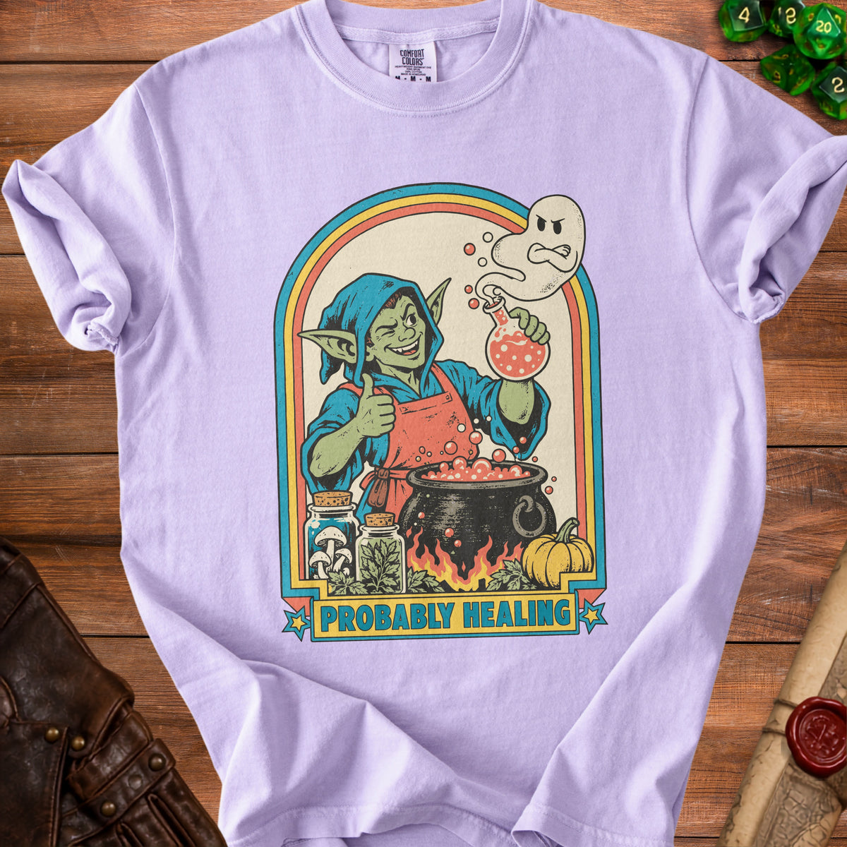 Purple t-shirt with a goblin making potions and the text "PROBABLY HEALING".