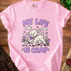 Pink t-shirt with cartoon lamb and text "MY LIFE IS CRAP".