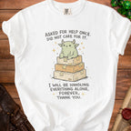 White t-shirt with cartoon monster on stacked boxes, text reads "Asked for help once. Did not care for it."