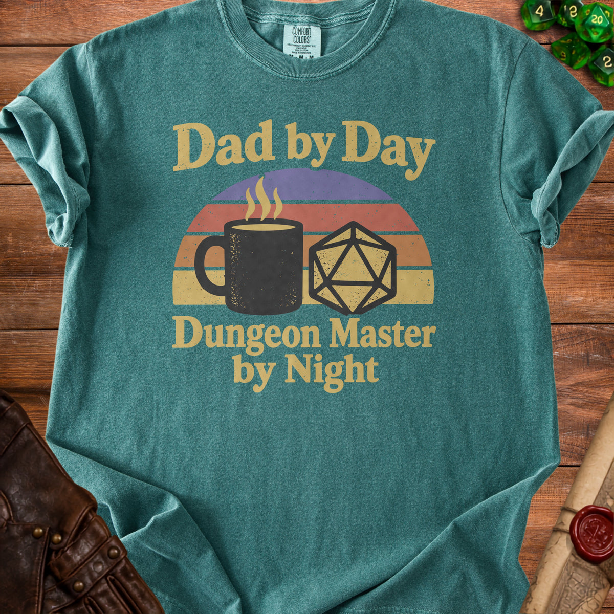 Teal t-shirt with "Dad by Day Dungeon Master by Night" text and dice graphic.