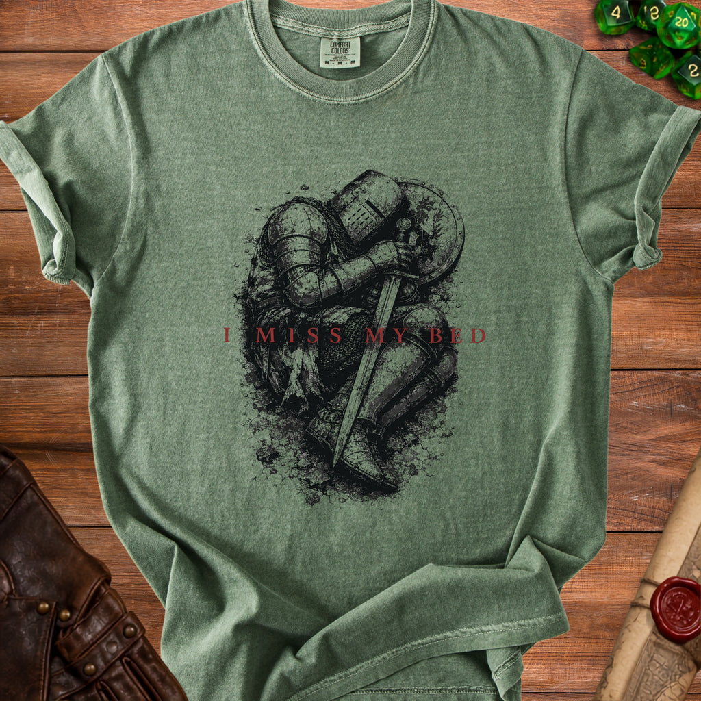 Green t-shirt with distressed graphic of knight kneeling and text "I MISS MY BED".