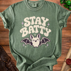 Green t-shirt with "STAY BATTY" text and a cute bat graphic.
