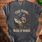 Dark grey t-shirt with a graphic of an owl in a witch hat reading a book, text says "The Tome Made It Worse".
