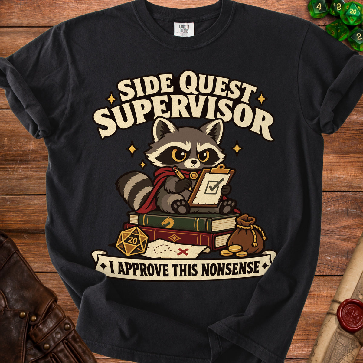A black t-shirt featuring a cartoon raccoon sitting on books with a clipboard, twenty-sided die, and text reading Side Quest Supervisor.