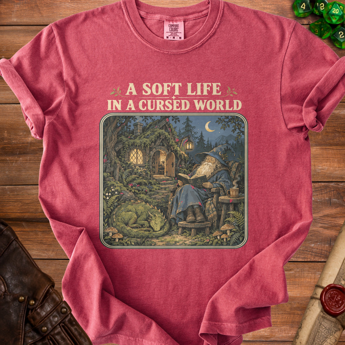 T-shirt with "A Soft Life In A Cursed World" text and wizard reading with dragon.