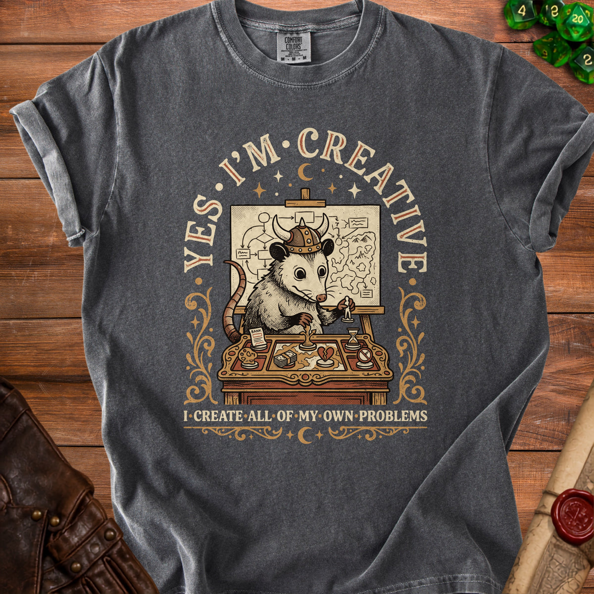 T-shirt graphic of a possum in a Viking helmet planning with a map and text "Yes, I'm Creative I Create All of My Own Problems".
