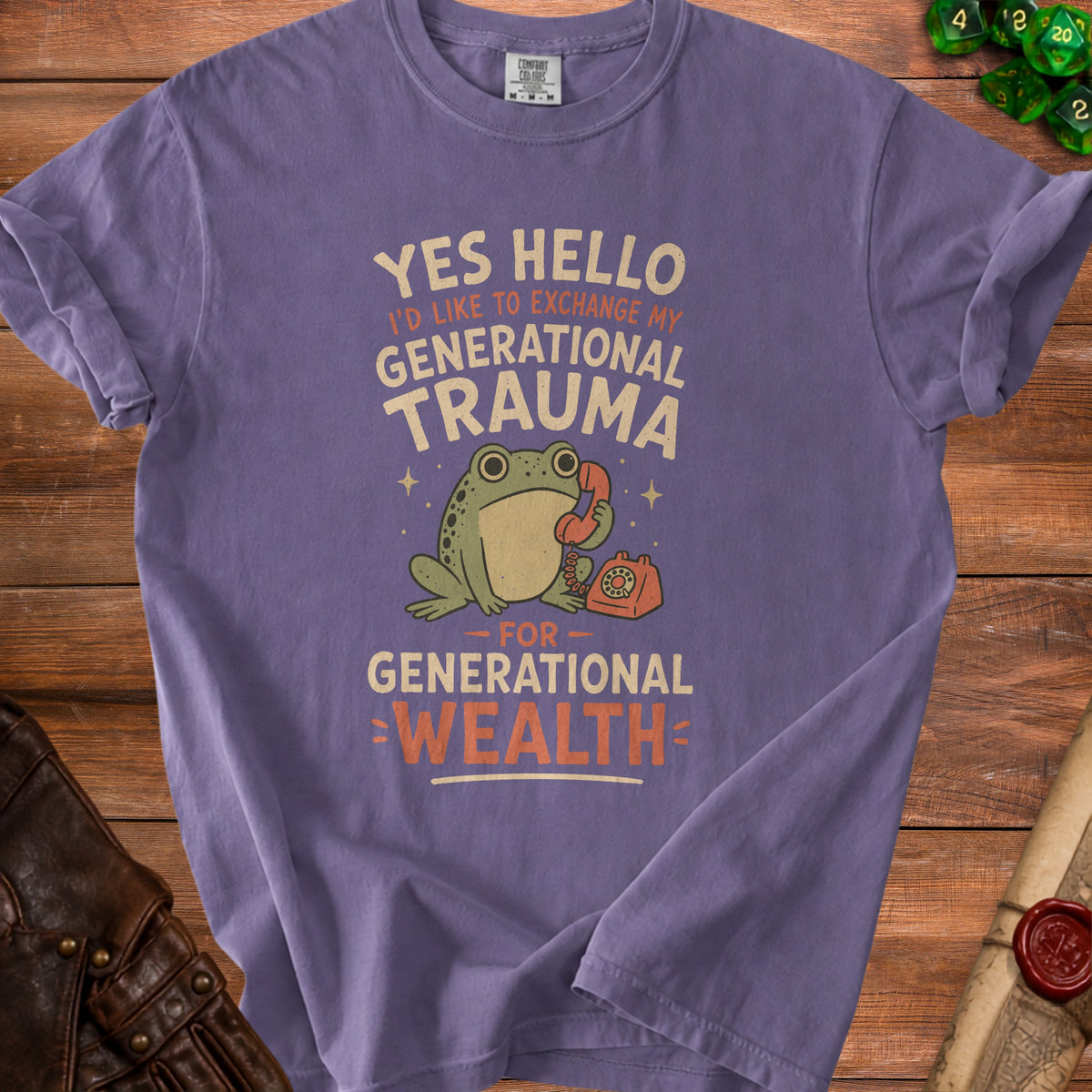 Purple t-shirt with frog on phone graphic and text "Yes hello I'd like to exchange my generational trauma for generational wealth."