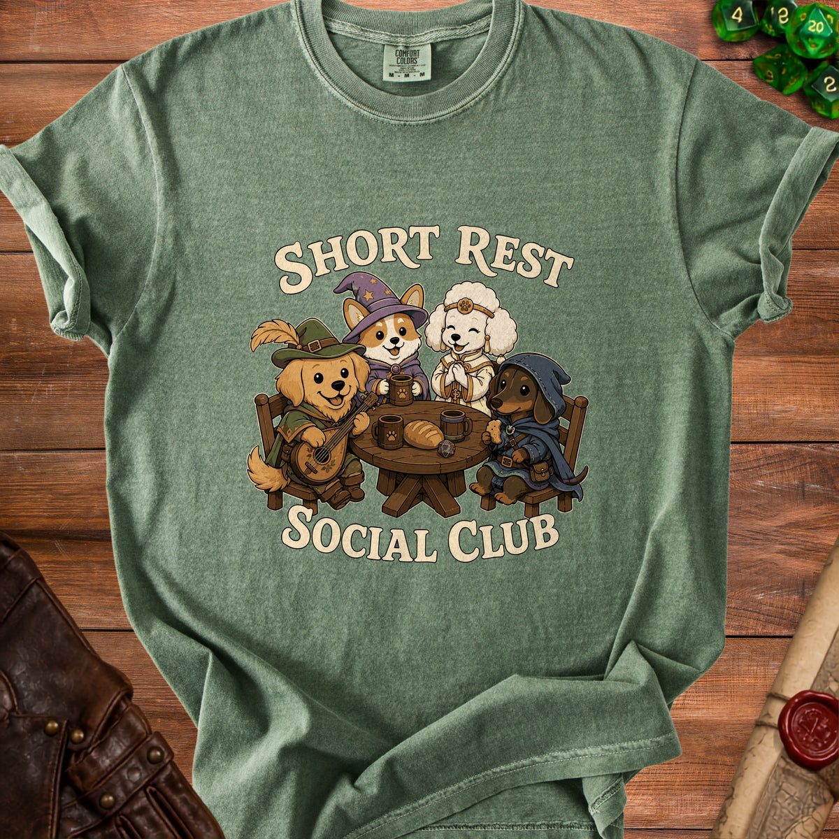 Green t-shirt with dogs dressed as fantasy characters at a table, text reads "Short Rest Social Club".