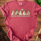 T-shirt with ghosts reading books and a map, text "normal wizard activities".
