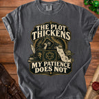 Dark gray t-shirt with "The Plot Thickens, My Patience Does Not" graphic.