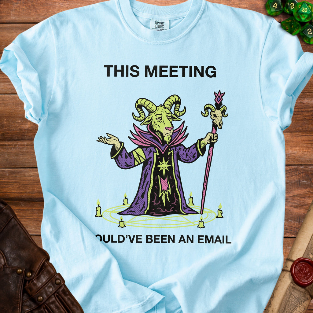 Light blue t-shirt with goat wizard graphic and text "THIS MEETING OULD'VE BEEN AN EMAIL".