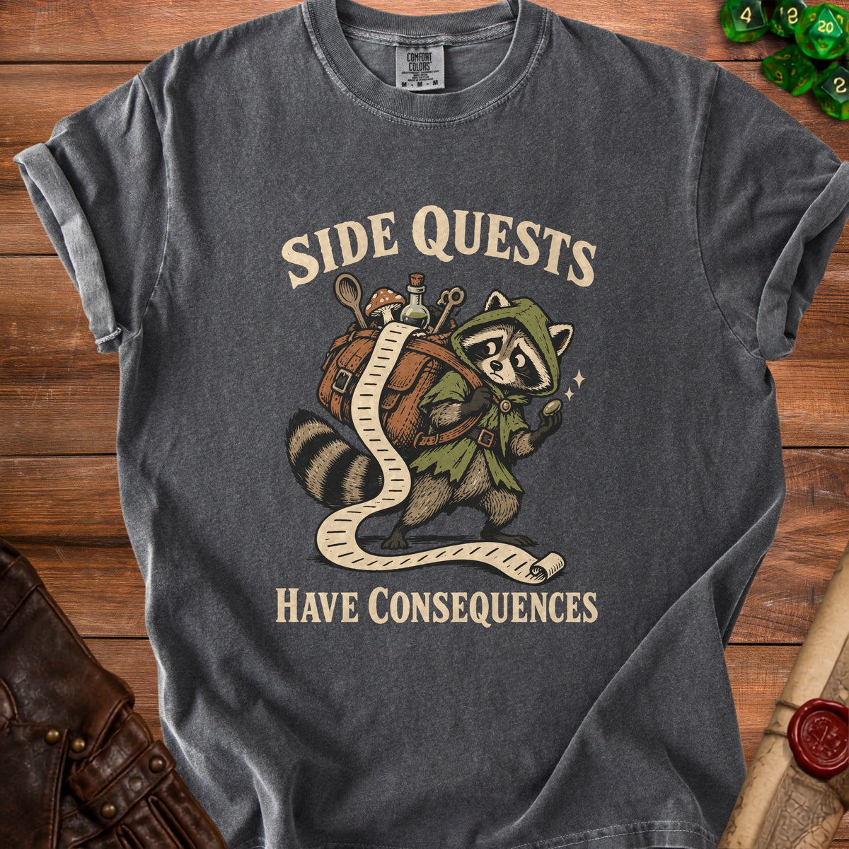 T-shirt with raccoon character carrying a long scroll, text "SIDE QUESTS HAVE CONSEQUENCES".