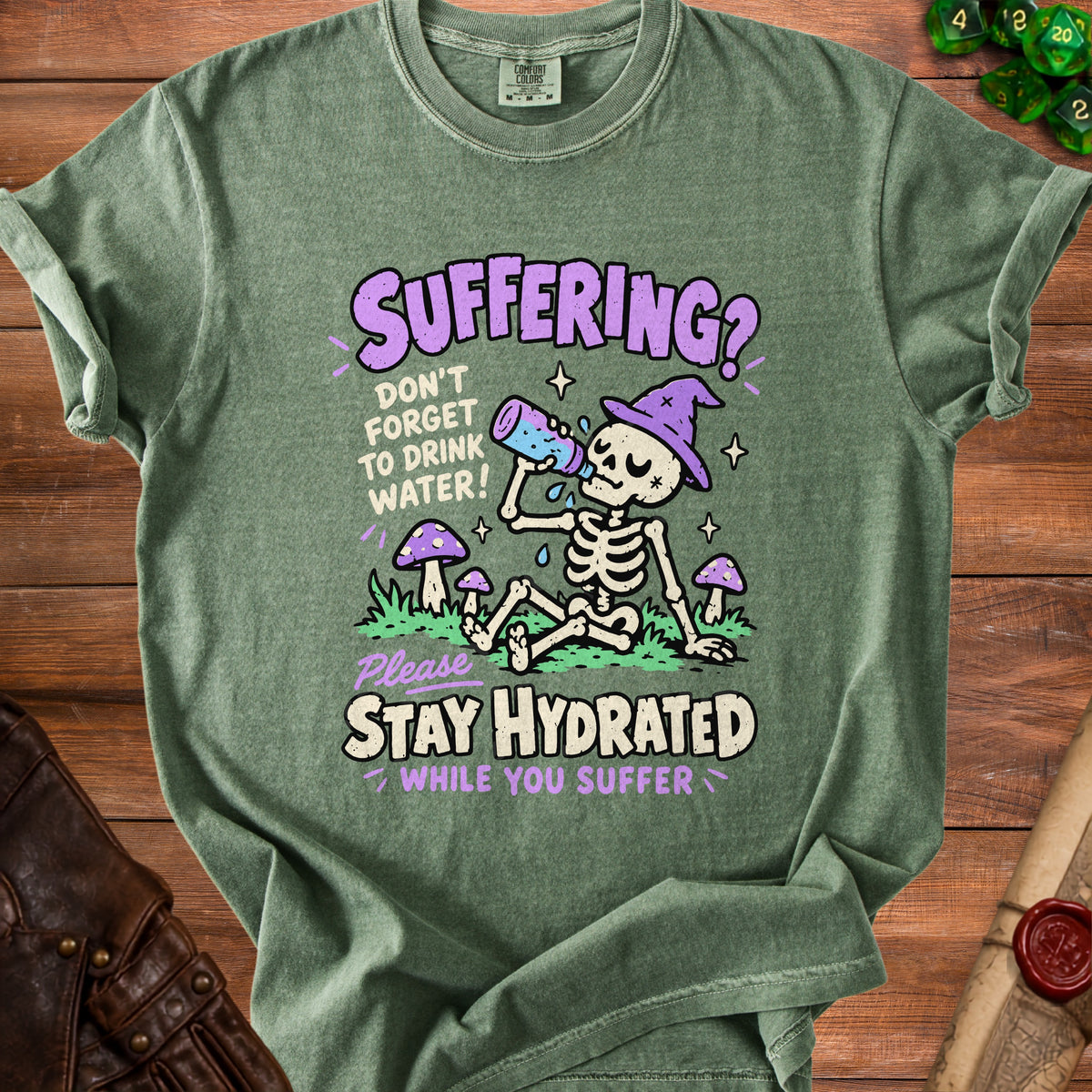 Green t-shirt with skeleton graphic: "SUFFERING? DON'T FORGET TO DRINK WATER!" and "STAY HYDRATED WHILE YOU SUFFER."
