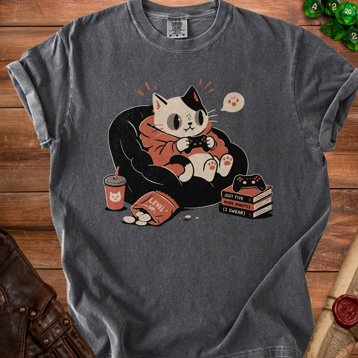 T-shirt graphic of a cat playing video games with chips and drink, text "Level Up".