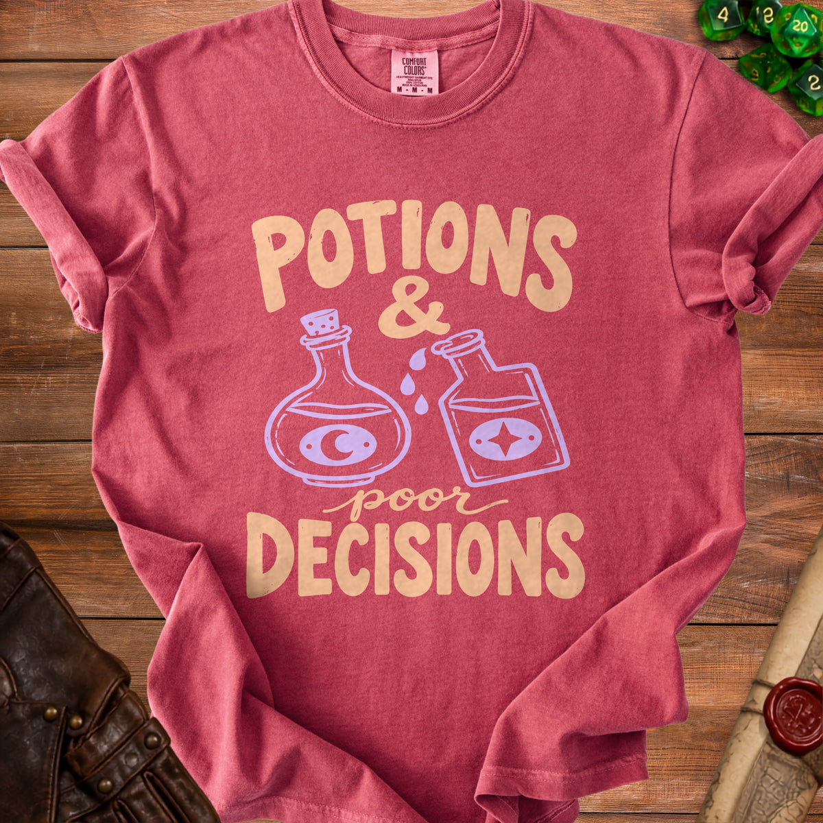 Red Comfort Colors t-shirt with "Potions & Poor Decisions" graphic.