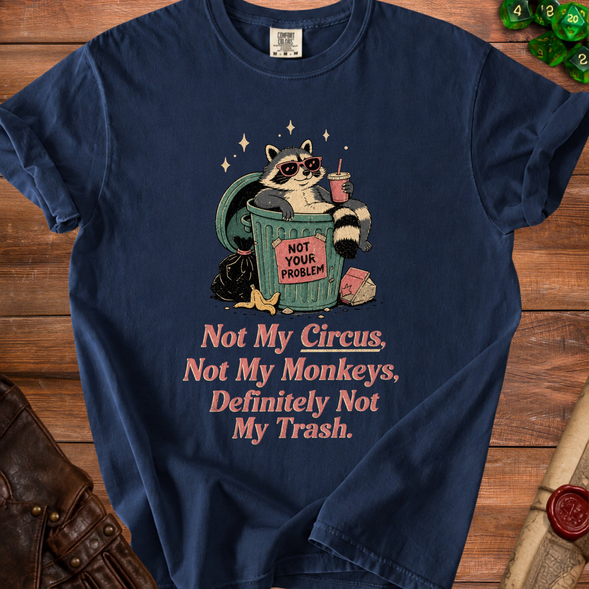 Navy t-shirt with raccoon in trash graphic saying "Not Your Problem" and "Not My Circus".