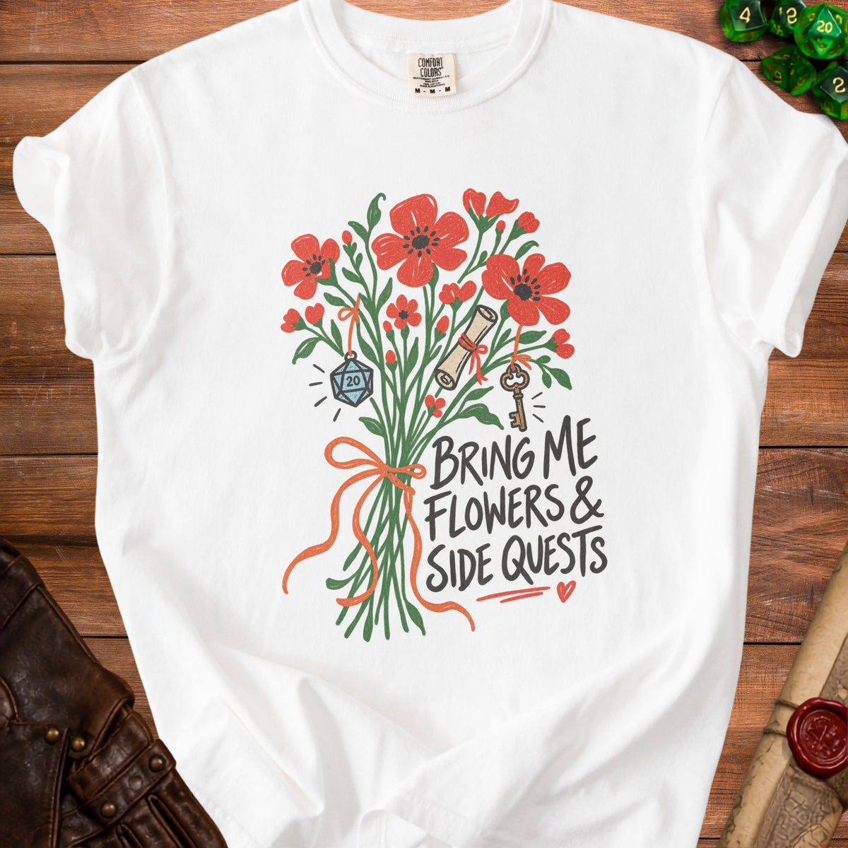 White t-shirt with a bouquet of flowers, dice, scroll, and key, with text "Bring Me Flowers & Side Quests".