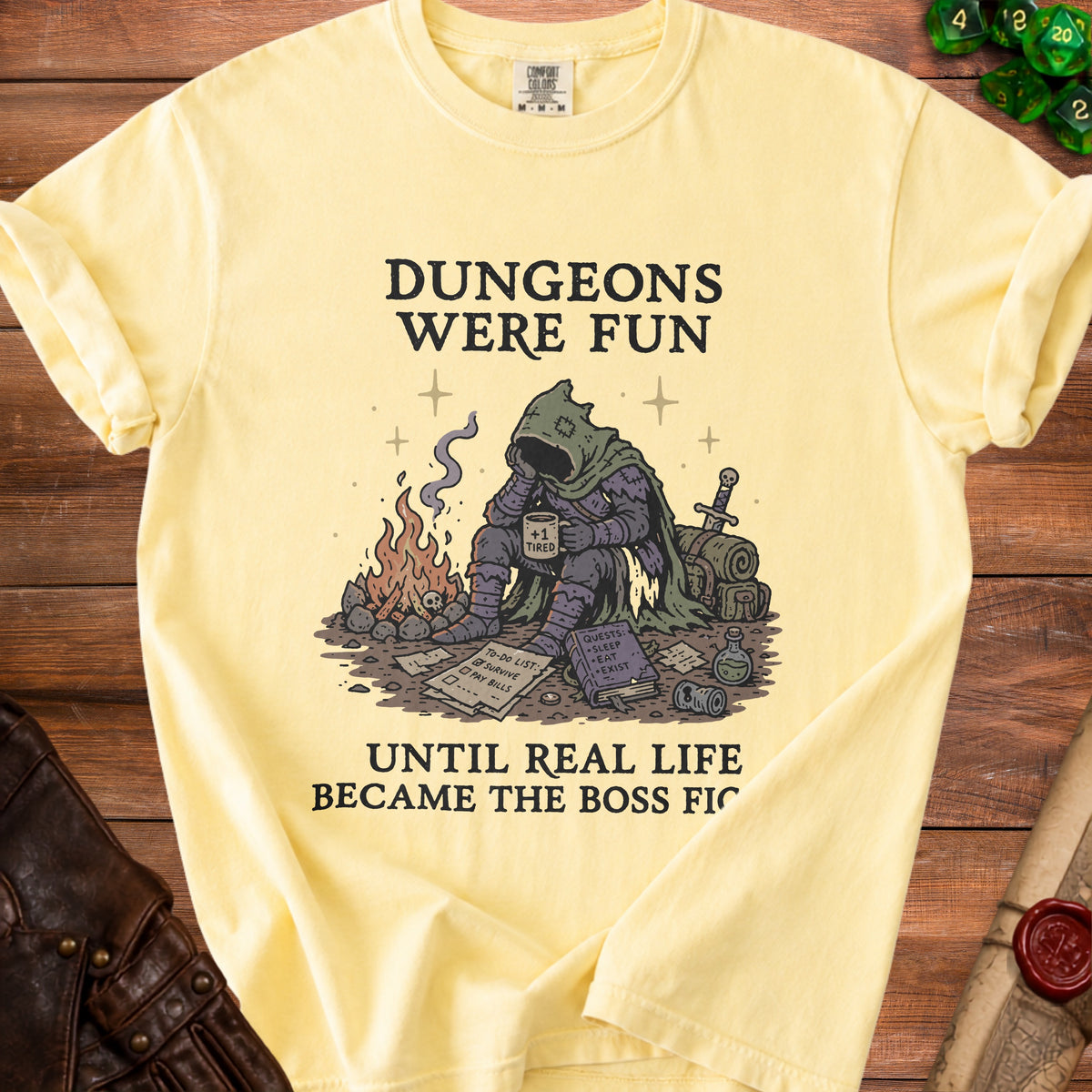 Yellow t-shirt with a knight character and text: Dungeons Were Fun Until Real Life Became the Boss Fight.
