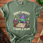 Green t-shirt with cartoon witch and map text "Don't Worry I Have a Plan."