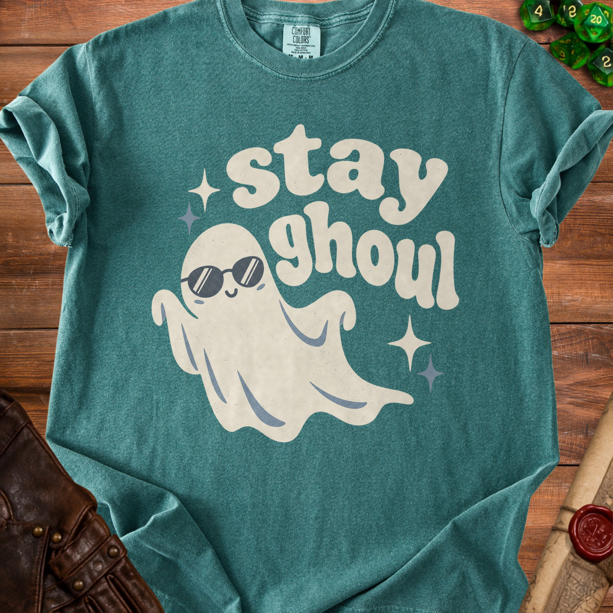 Teal t-shirt with ghost wearing sunglasses and text "stay ghoul".