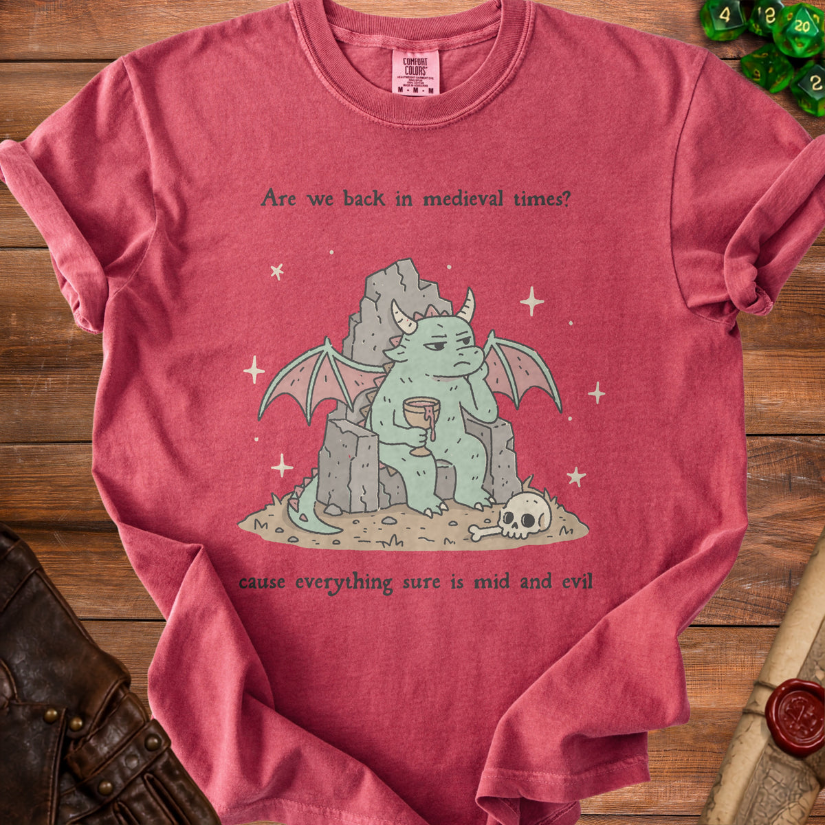 Shirt with a bored dragon on a throne, holding a drink, with text.
