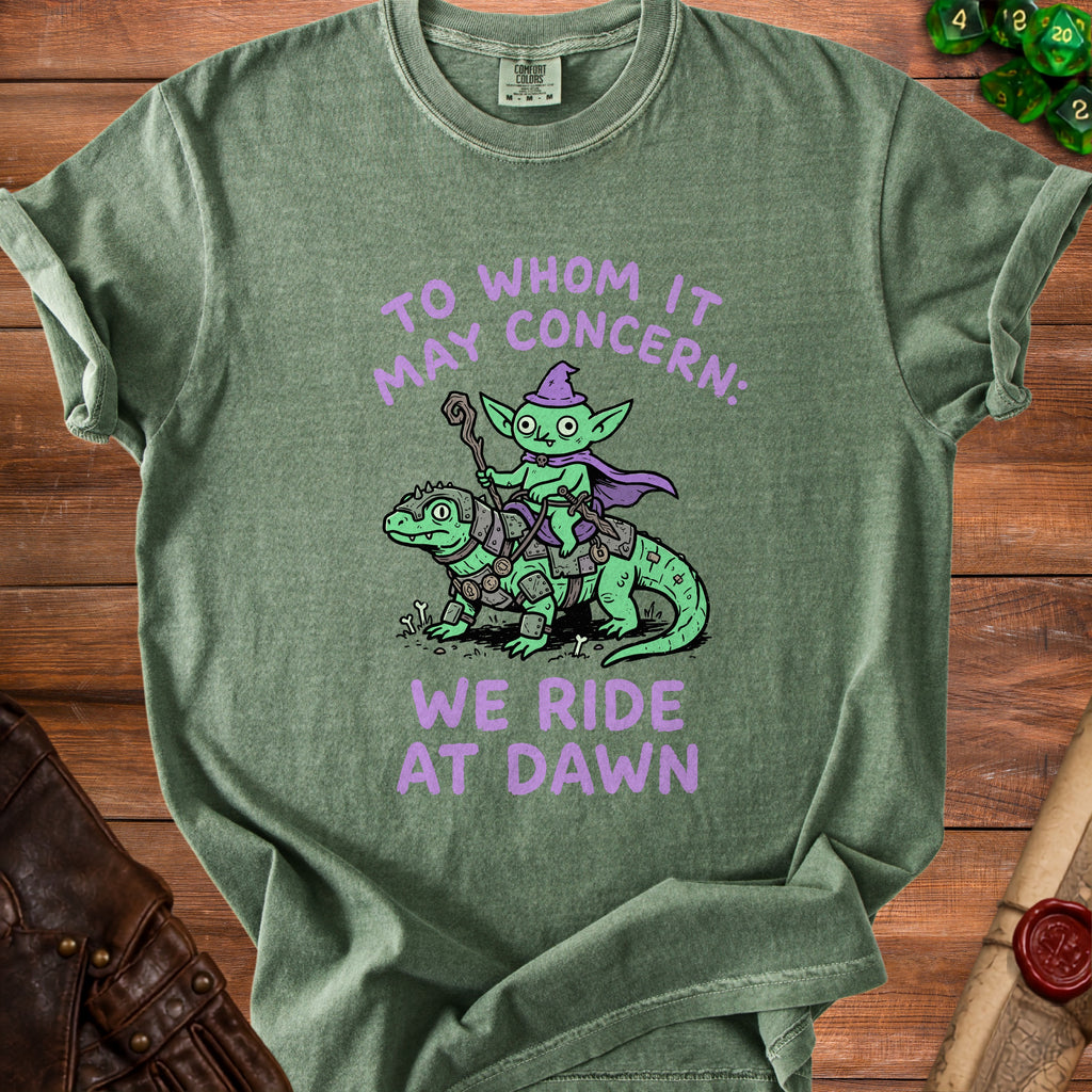 Green t-shirt with purple text and illustration of a goblin riding a lizard.