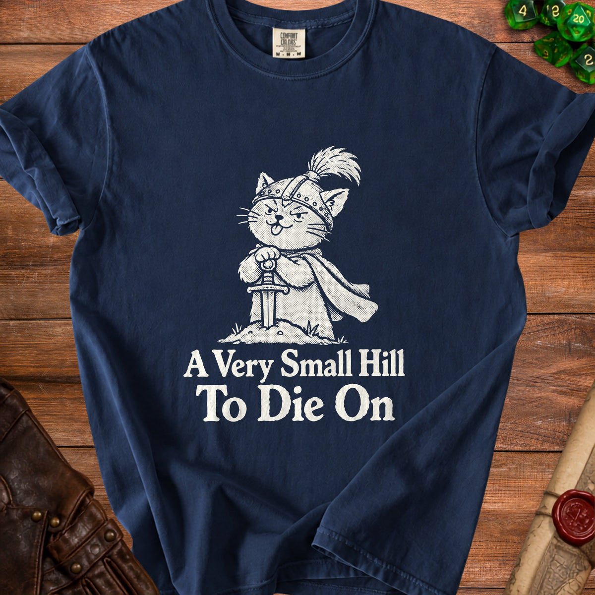 Navy t-shirt with a knight cat illustration and text "A Very Small Hill To Die On".