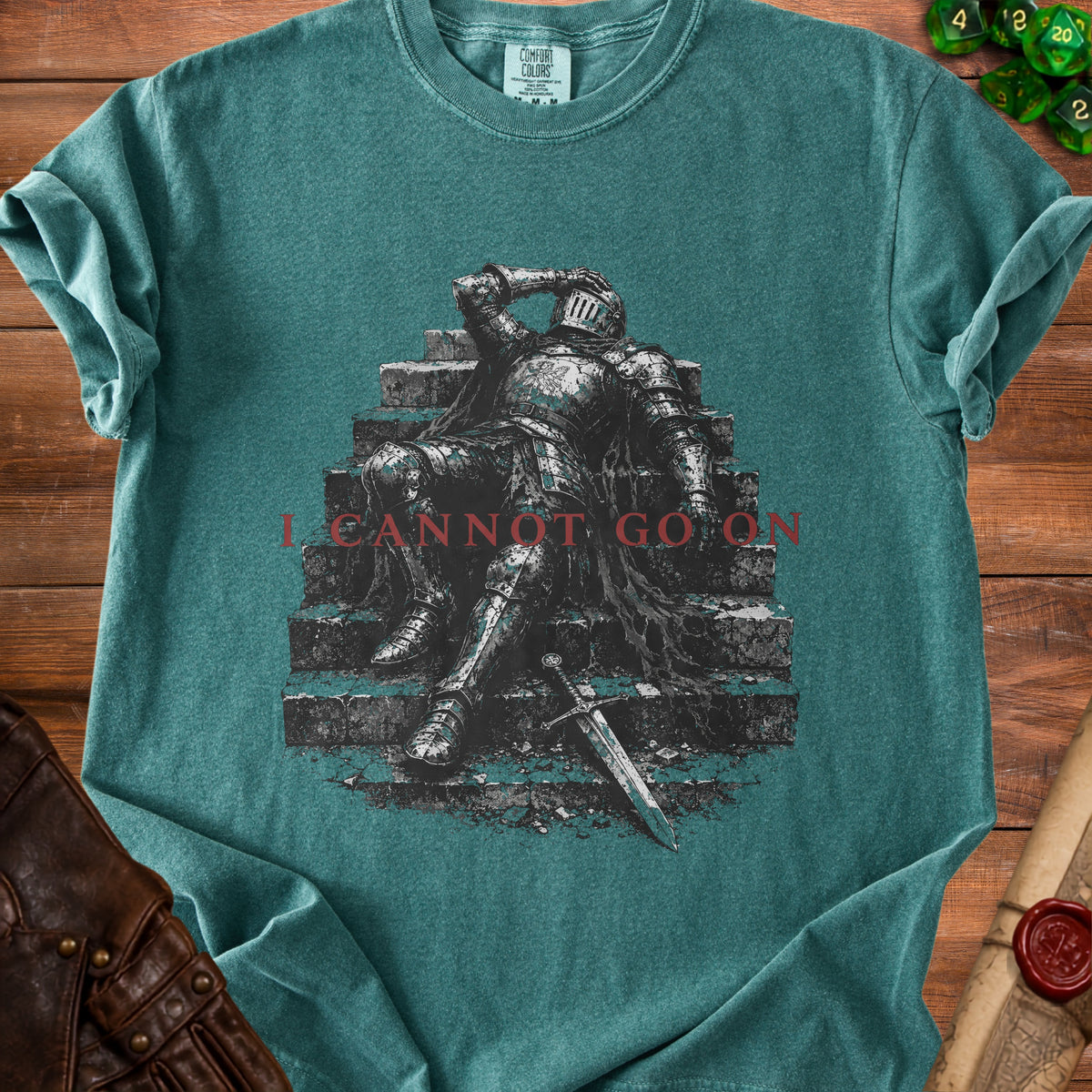 Green t-shirt with distressed knight armor graphic and text "I CANNOT GO ON".