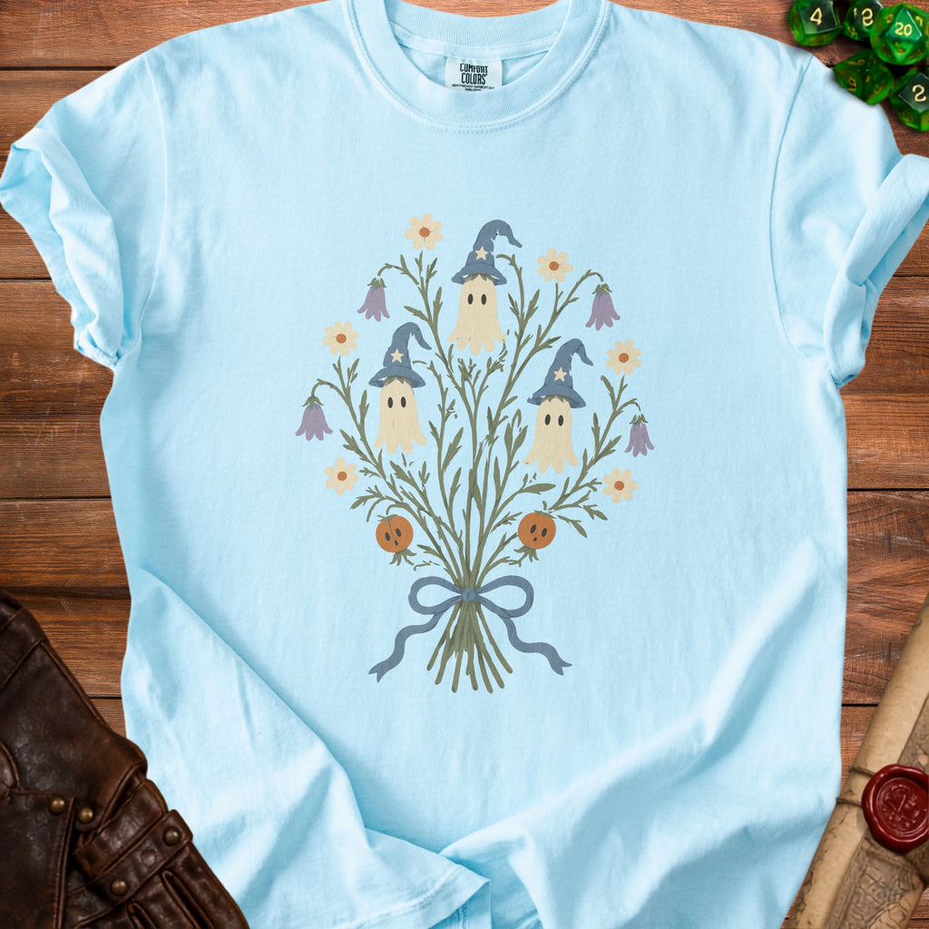 Light blue t-shirt with a floral ghost design and pumpkins.