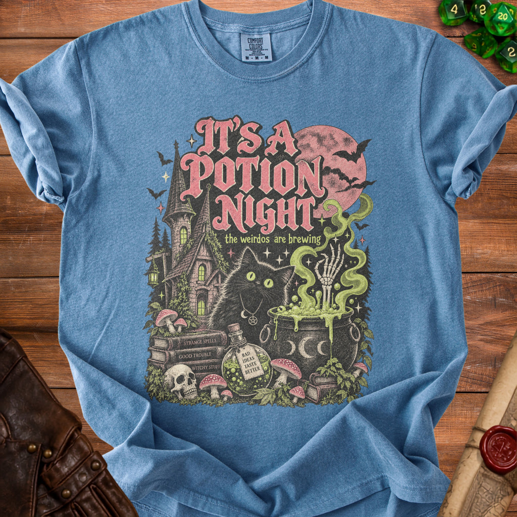 Blue t-shirt with "It's a Potion Night" text and spooky Halloween scene.