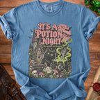Blue t-shirt with "It's a Potion Night" text and spooky Halloween scene.
