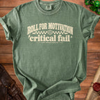 Green t-shirt with "Roll For Motivation, Critical Fail, Reroll Available Tomorrow" text.