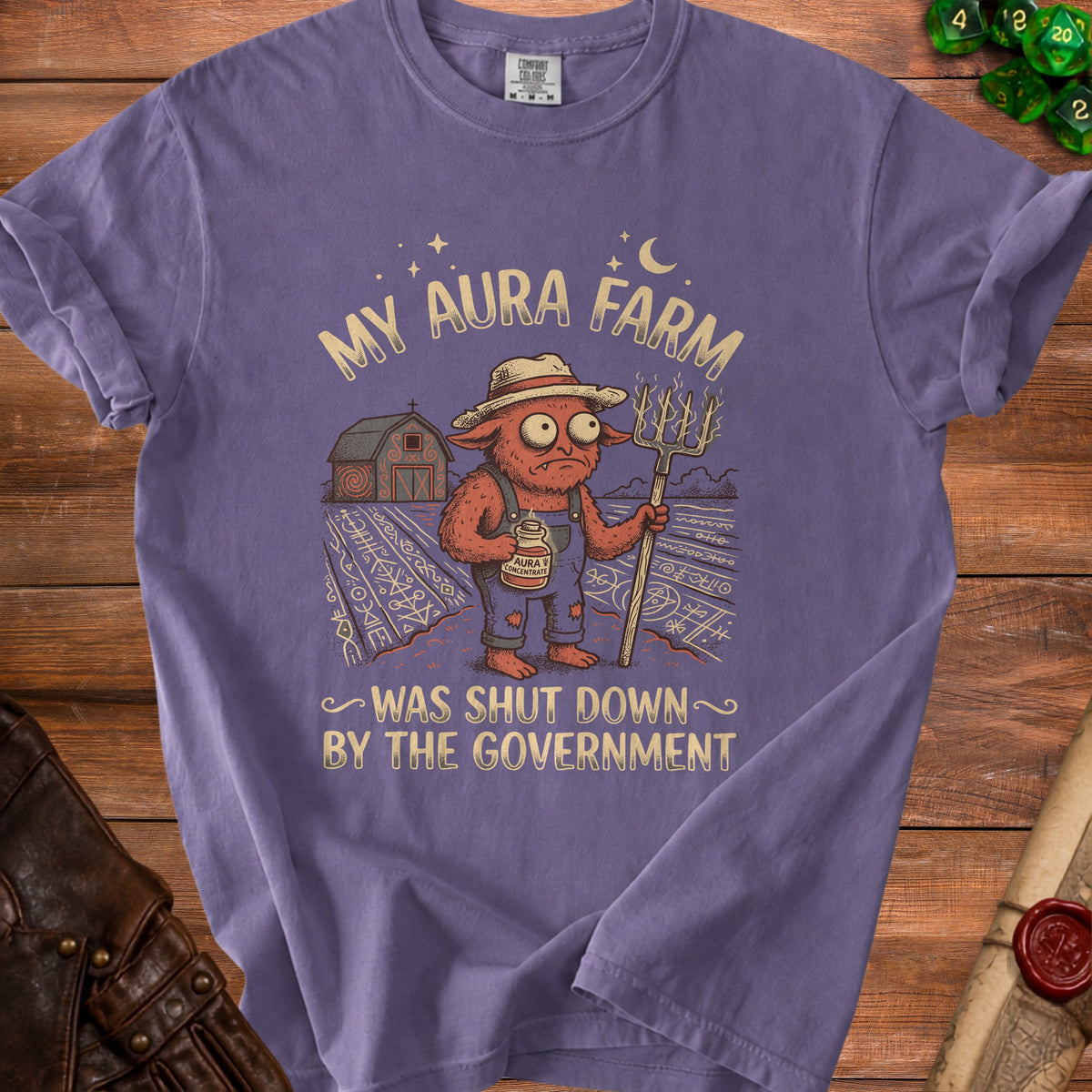 Purple t-shirt with "My Aura Farm Was Shut Down By The Government" text and artwork.