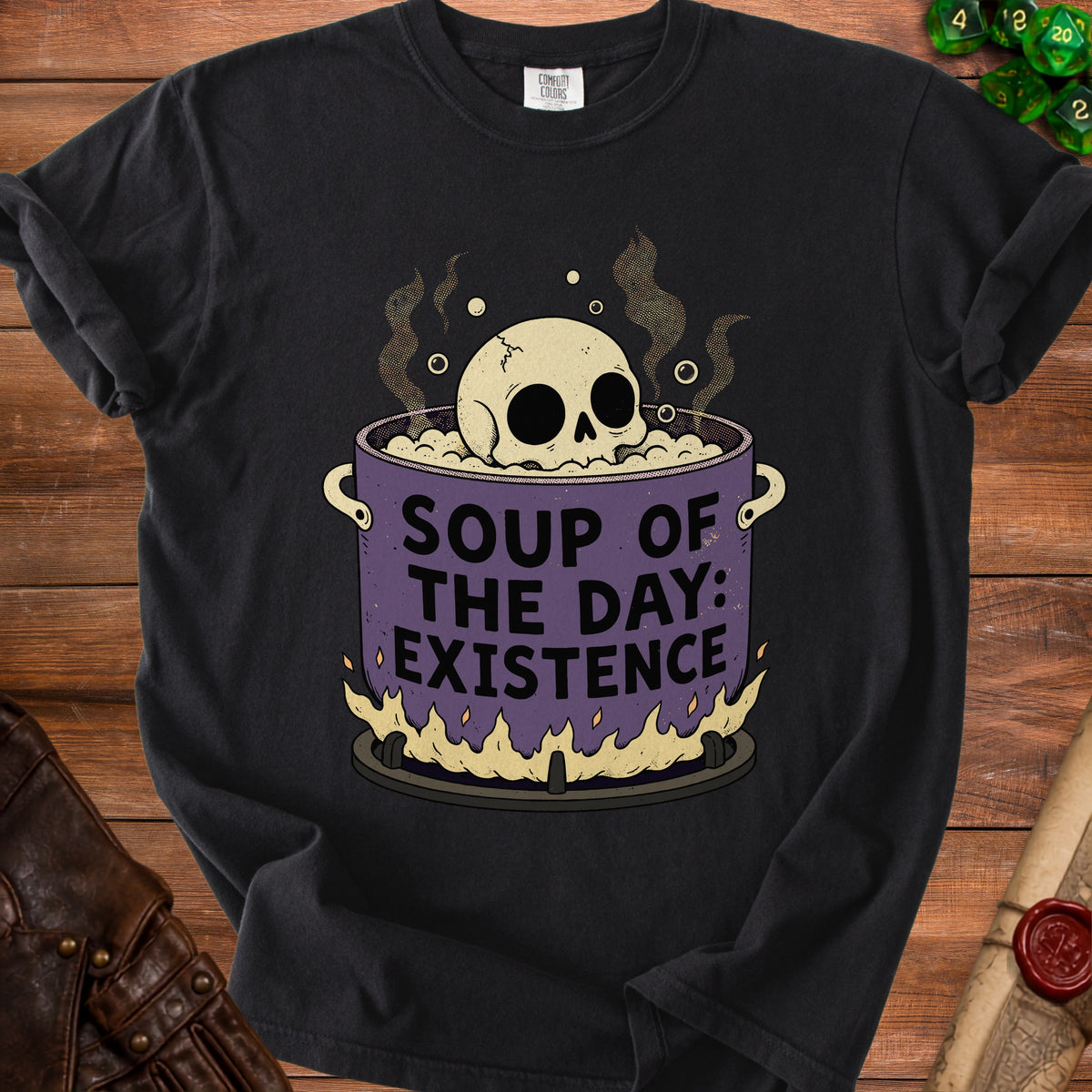 Skull in pot with text "SOUP OF THE DAY: EXISTENCE" on a black t-shirt.