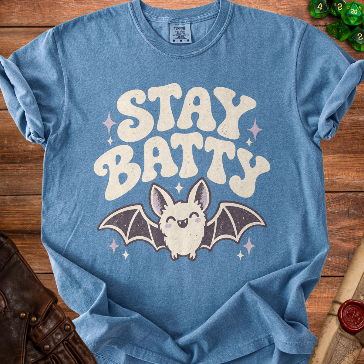 Blue t-shirt with "STAY BATTY" text and a cute bat graphic.