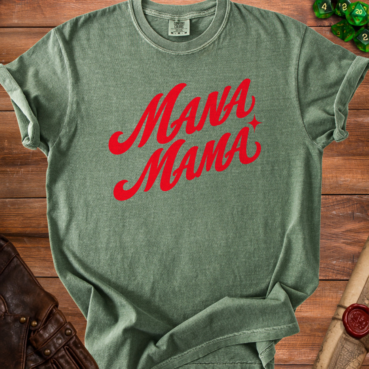 Green t-shirt with red "Mana Mama" text and a star accent.