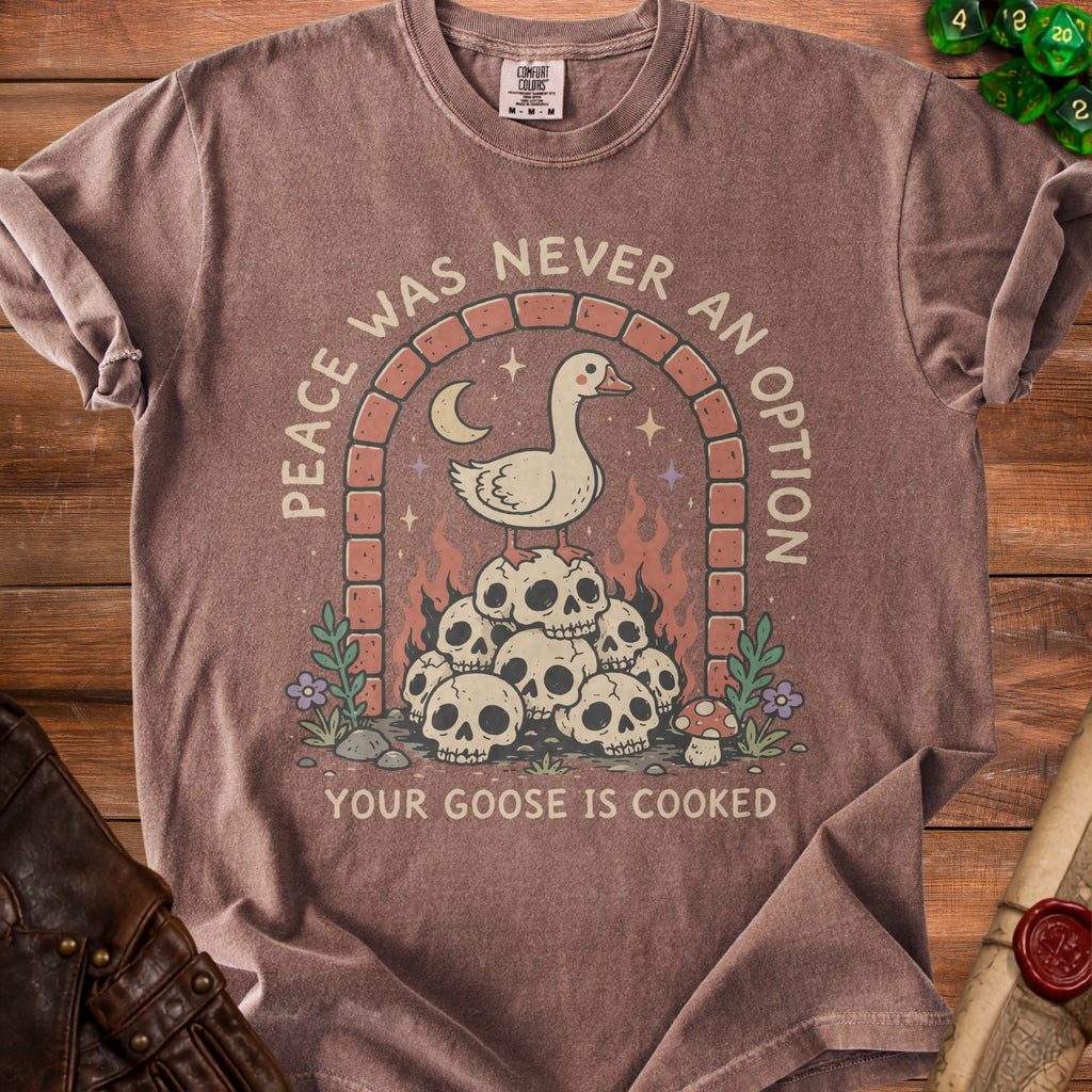 Brown t-shirt with a graphic of a goose on skulls under an archway with text.