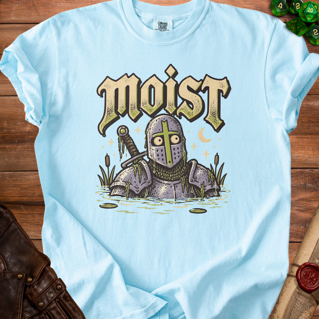 Light blue t-shirt with a knight in armor in water and the word "Moist" on it.