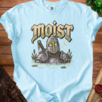 Light blue t-shirt with a knight in armor in water and the word "Moist" on it.
