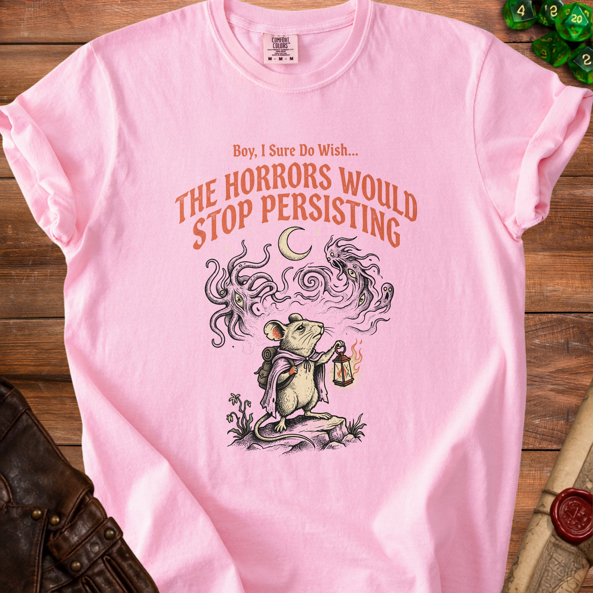 Pink t-shirt with "Boy, I Sure Do Wish... The Horrors Would Stop Persisting" text and mouse graphic.