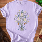 Light purple t-shirt with a ghost bouquet graphic featuring pumpkins and wizard hats.