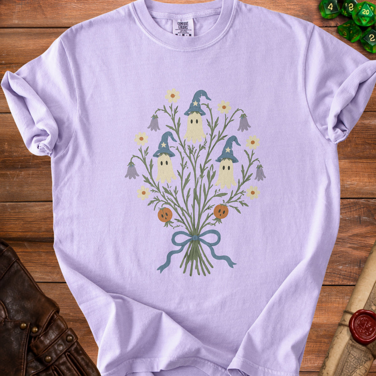 Light purple t-shirt with a ghost bouquet graphic featuring pumpkins and wizard hats.