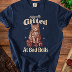 Navy t-shirt with a cat and dice graphic, text "Naturally Gifted At Bad Rolls".