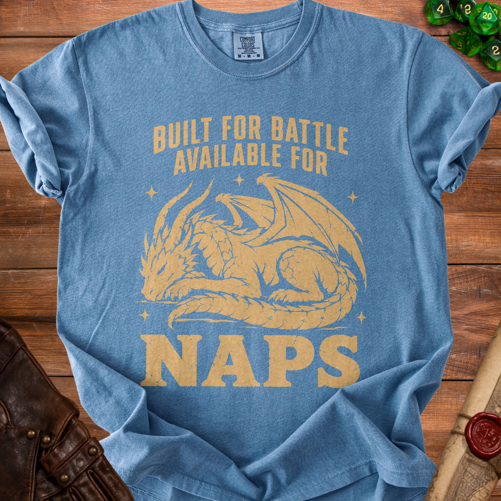 Blue t-shirt with gold text "BUILT FOR BATTLE AVAILABLE FOR NAPS" and a dragon graphic.